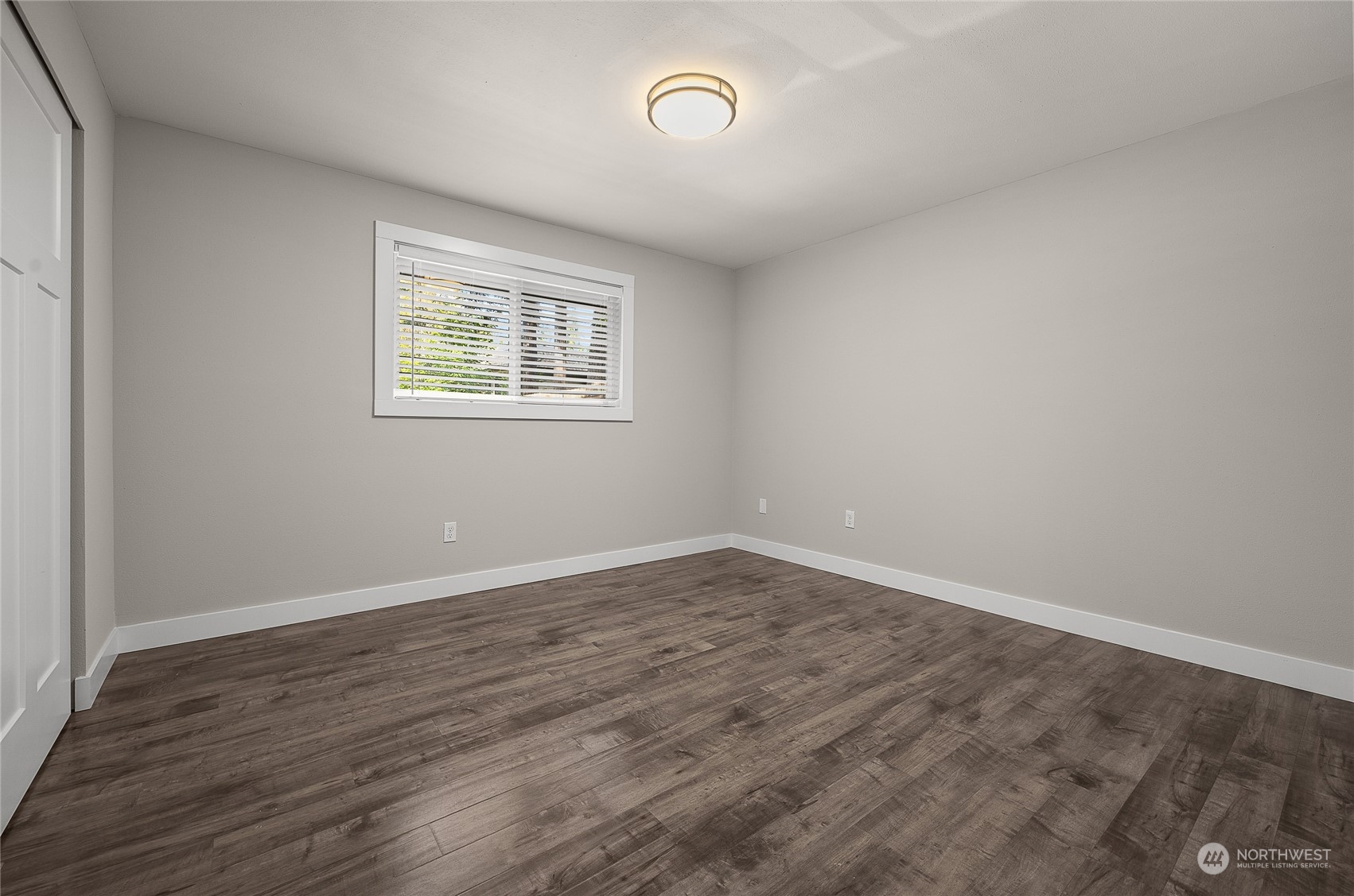 9512 Edmonds Way Edmonds, WA 98020 - Photo 18 of 24 wooden floor in an empty room with a window