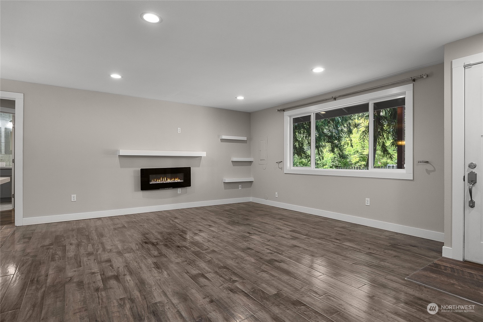 9512 Edmonds Way Edmonds, WA 98020 - Photo 4 of 24 an empty room with windows and fireplace