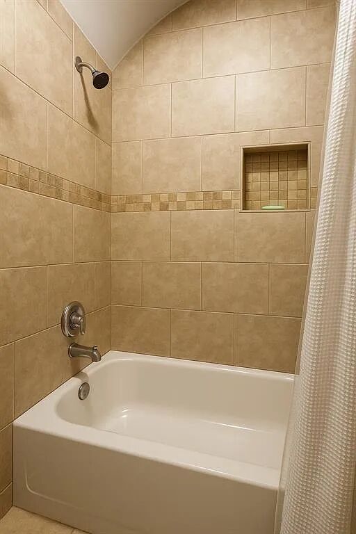 4420 Red River Street, Unit B Austin, TX 78751 - Photo 9 of 11 A well-appointed bath features a tiled shower and tub for comfortable rejuvenation.