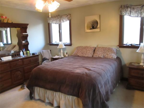 1590 Bay Road Stoughton, MA 02072 - Photo 17 of 22 a bedroom with a bed and window
