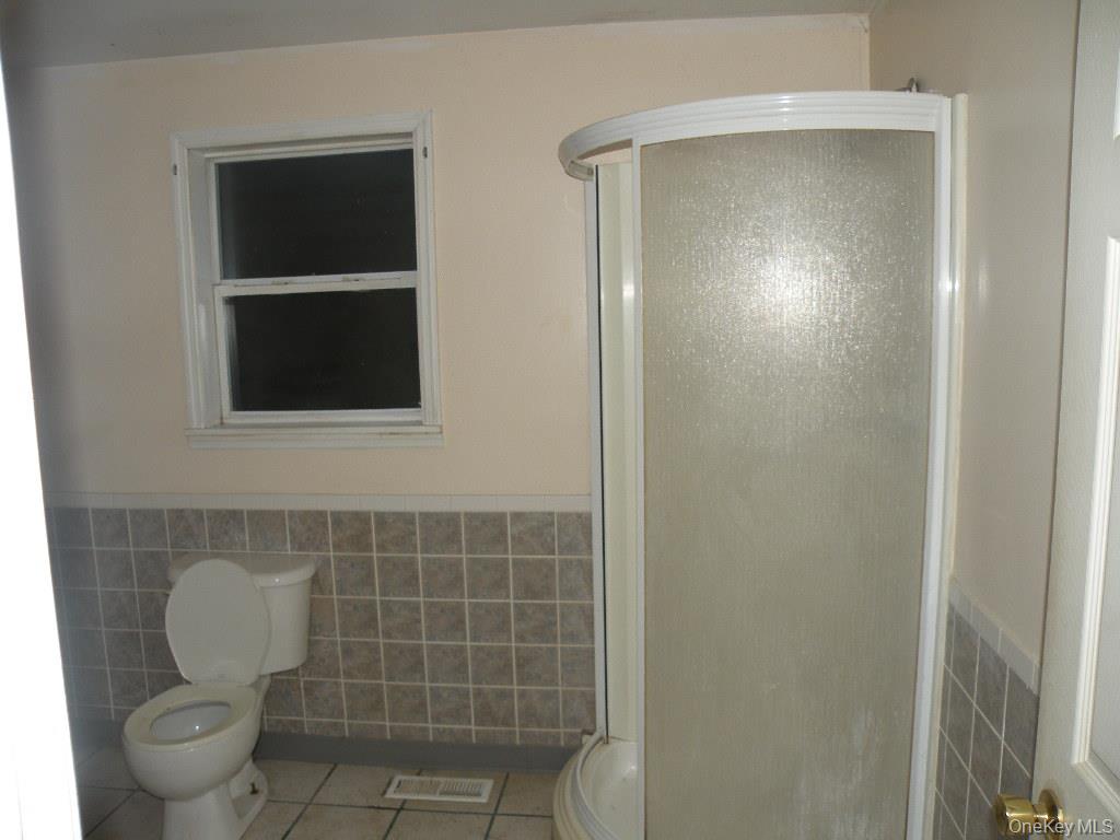 618 Bean River Road Millerton, NY 12546 - Photo 13 of 16 a bathroom with a toilet and a window