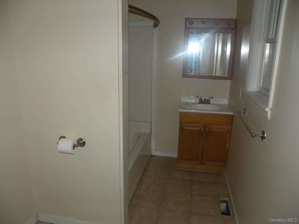 618 Bean River Road Millerton, NY 12546 - Photo 14 of 16 a bathroom with a sink and mirror