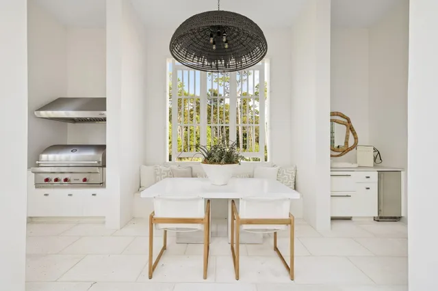 a living room with furniture and view of kitchen