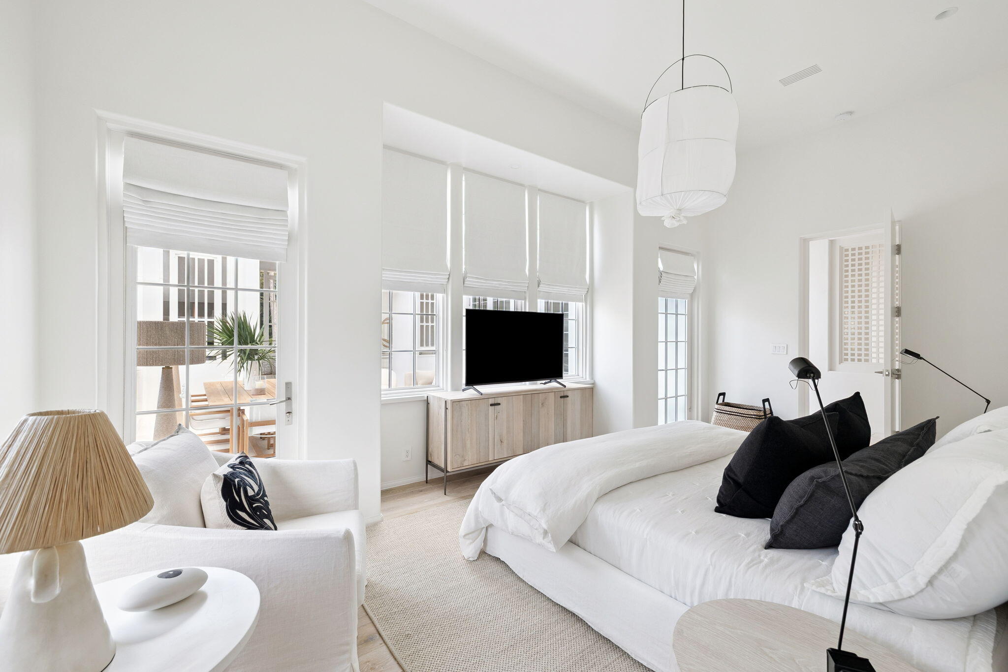 53 Portico Ln Inlet Beach Inlet Beach, FL 32461 - Photo 22 of 47 a bedroom with a bed and a flat screen tv