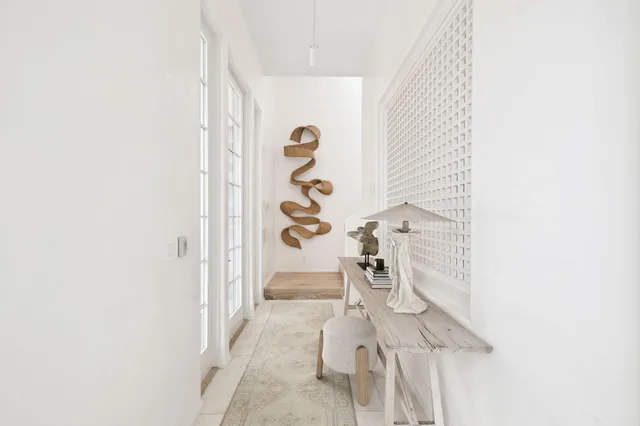 a bedroom with furniture and a rug