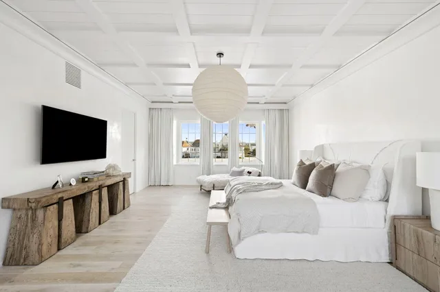 a bed room with bed and a large window