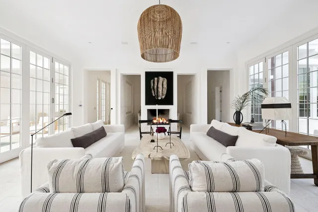 a bedroom with a large bed and a large window