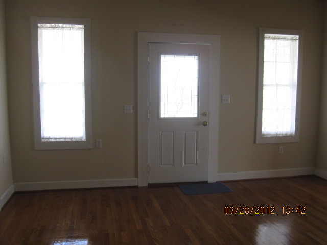 7154 Dry Hill Road Ferrum, VA 24088 - Photo 5 of 12 a view of an empty room with wooden floor and a window