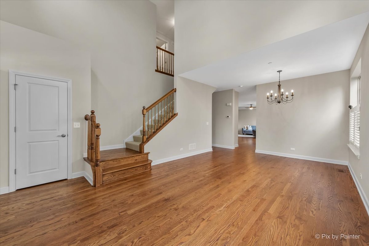 2122 Shermer Road Glenview, IL 60026 - Photo 13 of 37 a view of empty room with wooden floor and ceiling fan