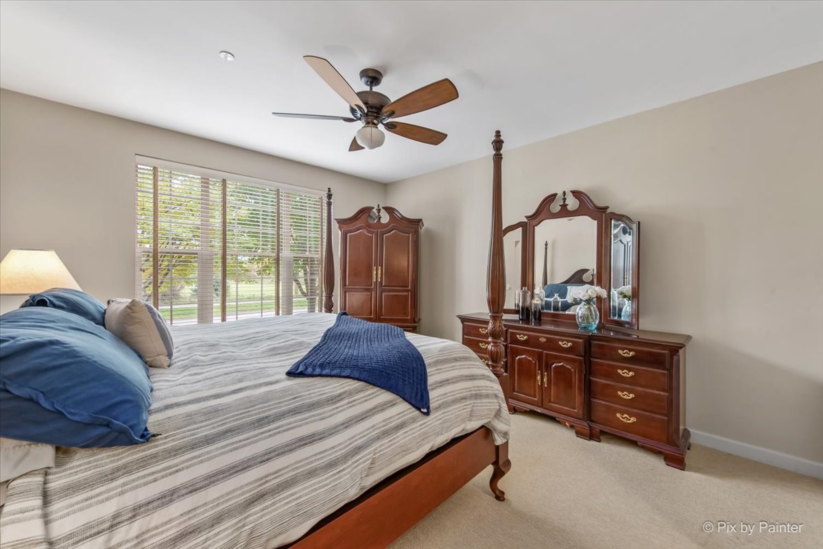 2122 Shermer Road Glenview, IL 60026 - Photo 15 of 37 a bedroom with a bed a dresser and window