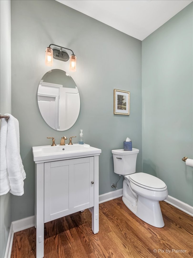 2122 Shermer Road Glenview, IL 60026 - Photo 18 of 37 a bathroom with a toilet a sink and mirror