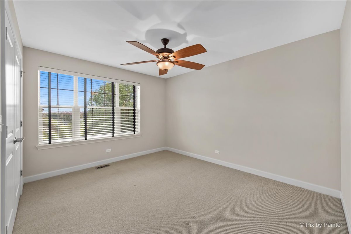 2122 Shermer Road Glenview, IL 60026 - Photo 21 of 37 an empty room with windows and fan