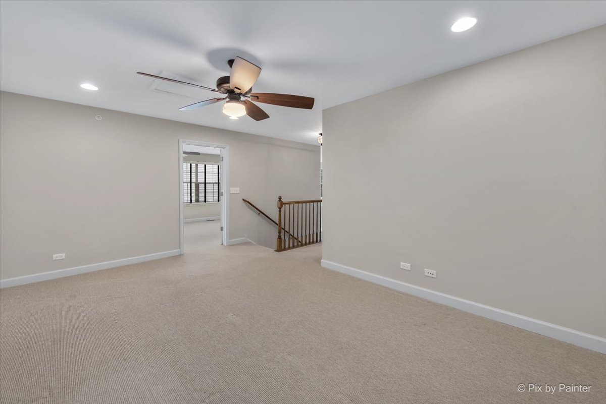 2122 Shermer Road Glenview, IL 60026 - Photo 25 of 37 en empty room with ceiling fan and window