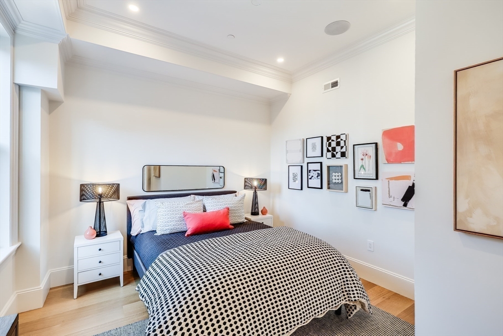 1 Fairfield Street Boston, MA 02116 - Photo 15 of 28 a bedroom with a bed and cabinets