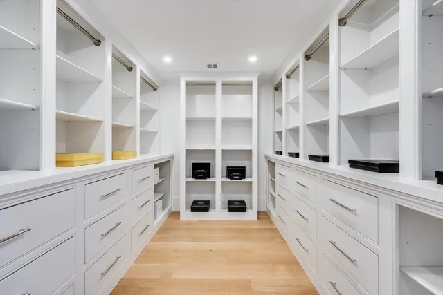a view of an empty walk in closet