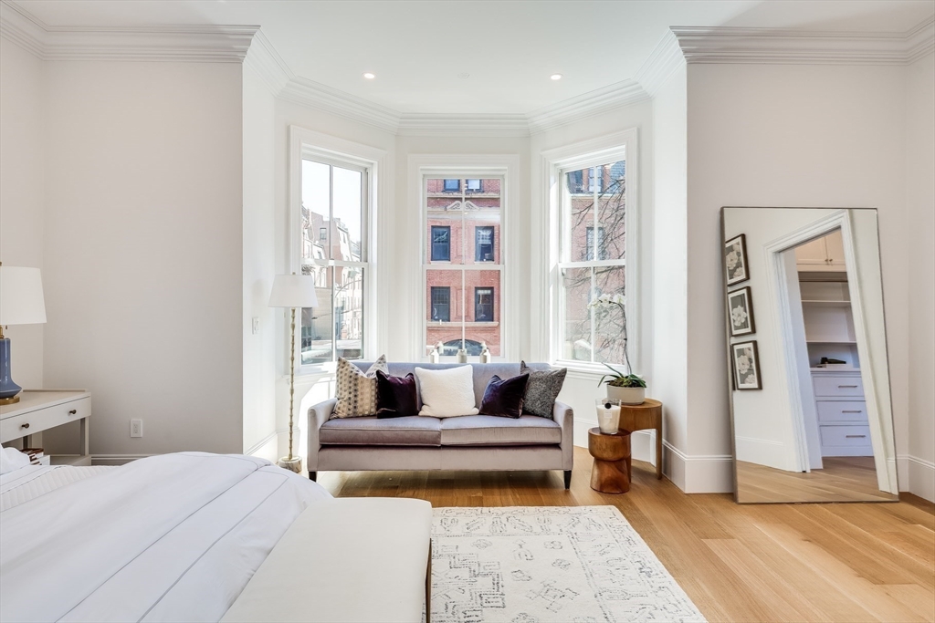 1 Fairfield Street Boston, MA 02116 - Photo 20 of 28 a spacious bedroom with a large bed and a couch