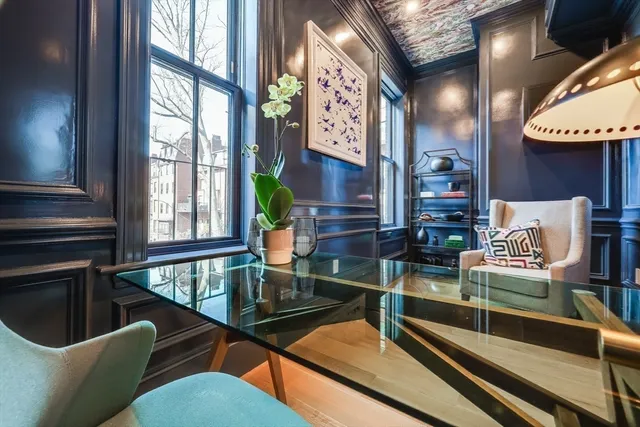 a view of a chairs and table in a balcony