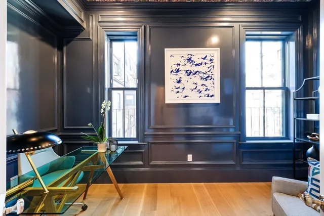 a view of a room with furniture and window