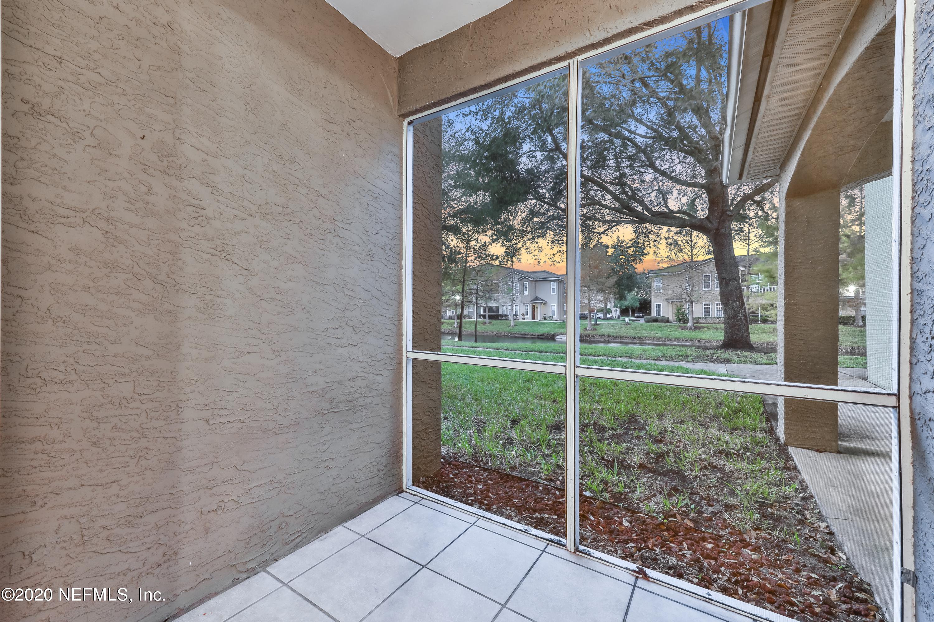 10075 Gate Parkway, Unit 1009 Jacksonville, FL 32246 - Photo 12 of 51 a view of a house with a backyard