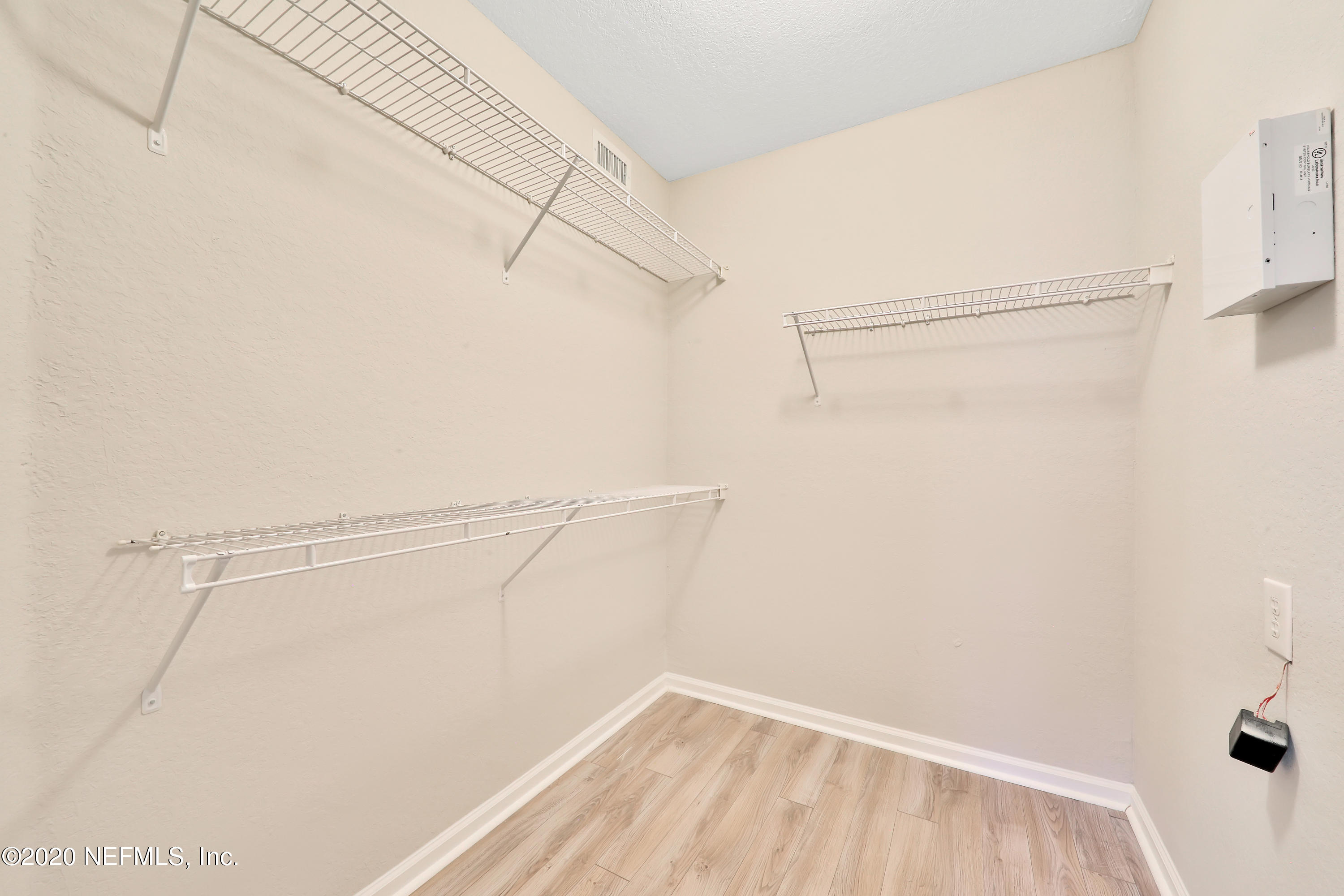 10075 Gate Parkway, Unit 1009 Jacksonville, FL 32246 - Photo 18 of 51 a view of a room with racks on the wall