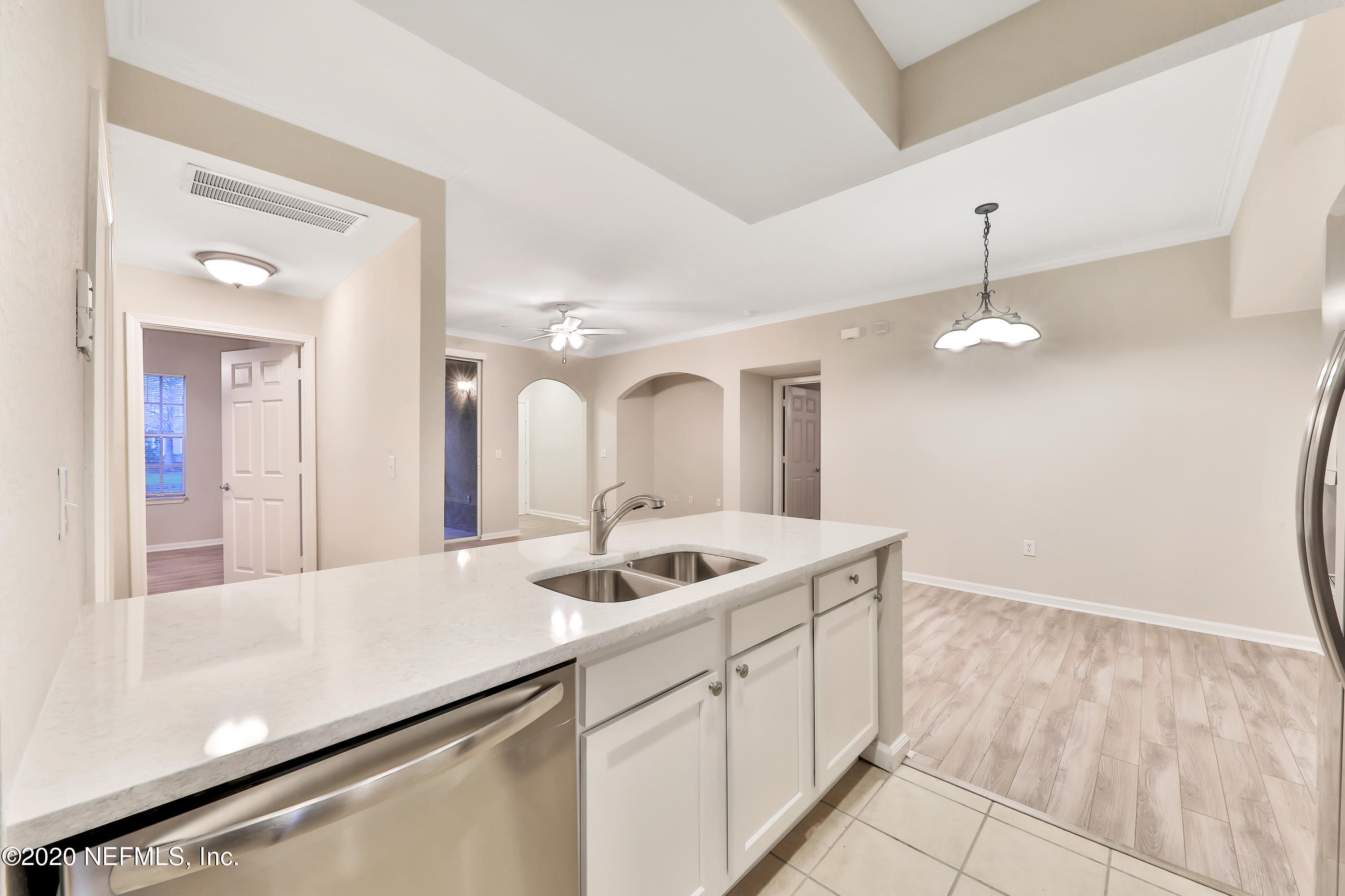 10075 Gate Parkway, Unit 1009 Jacksonville, FL 32246 - Photo 21 of 51 a kitchen with a sink and chandelier