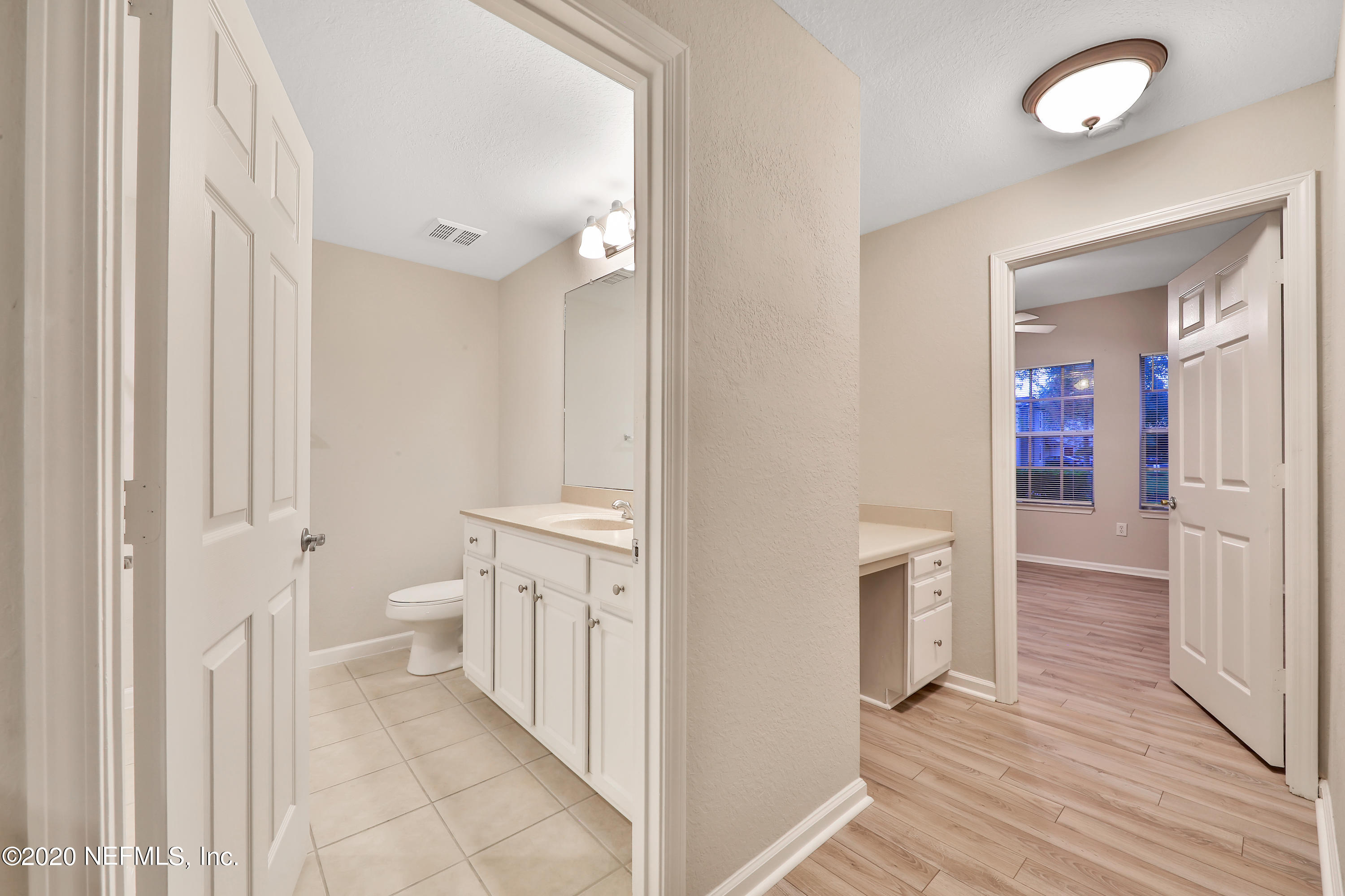 10075 Gate Parkway, Unit 1009 Jacksonville, FL 32246 - Photo 22 of 51 a bathroom with a sink and a toilet