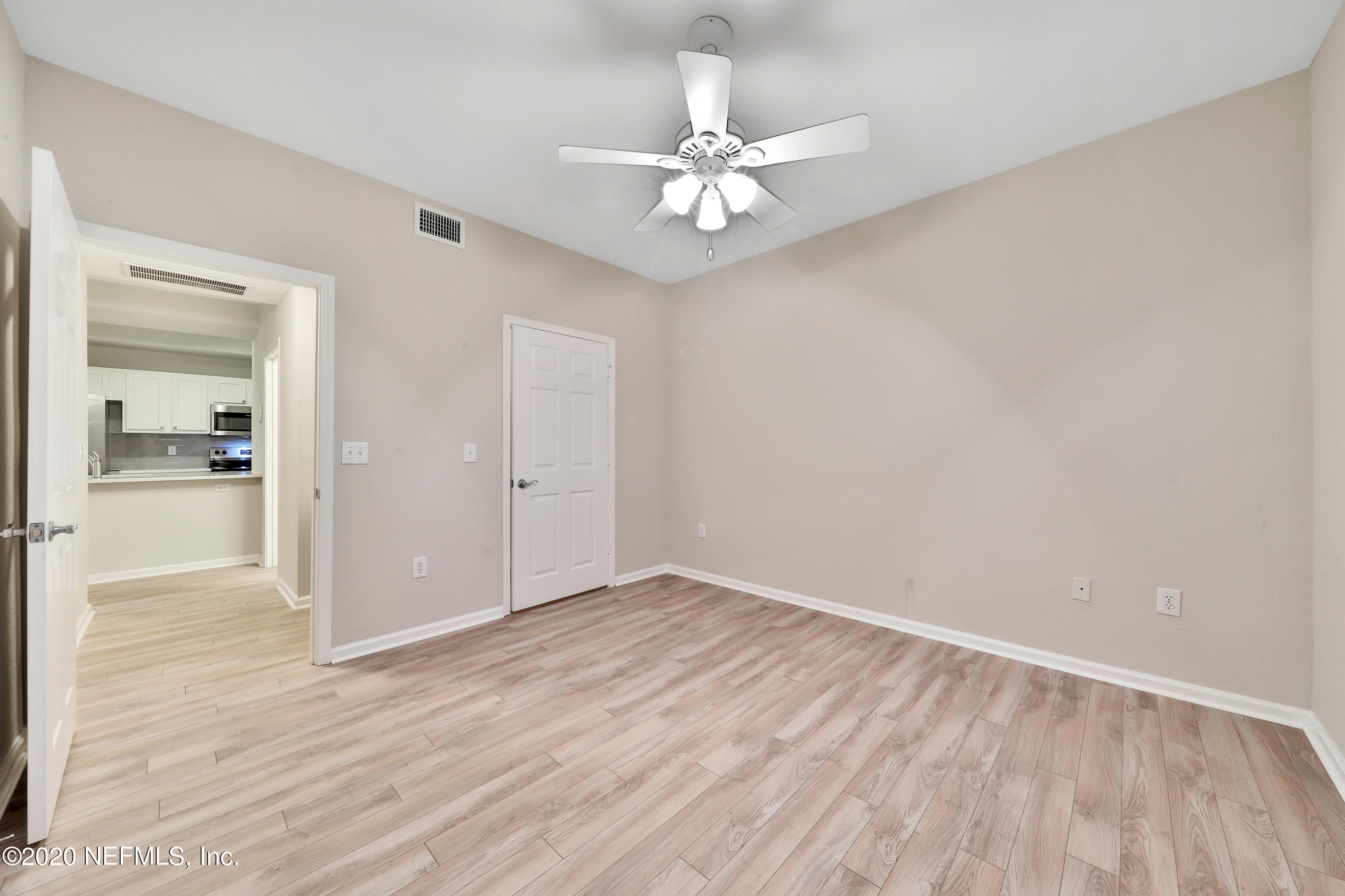 10075 Gate Parkway, Unit 1009 Jacksonville, FL 32246 - Photo 25 of 51 a view of an empty room with wooden floor