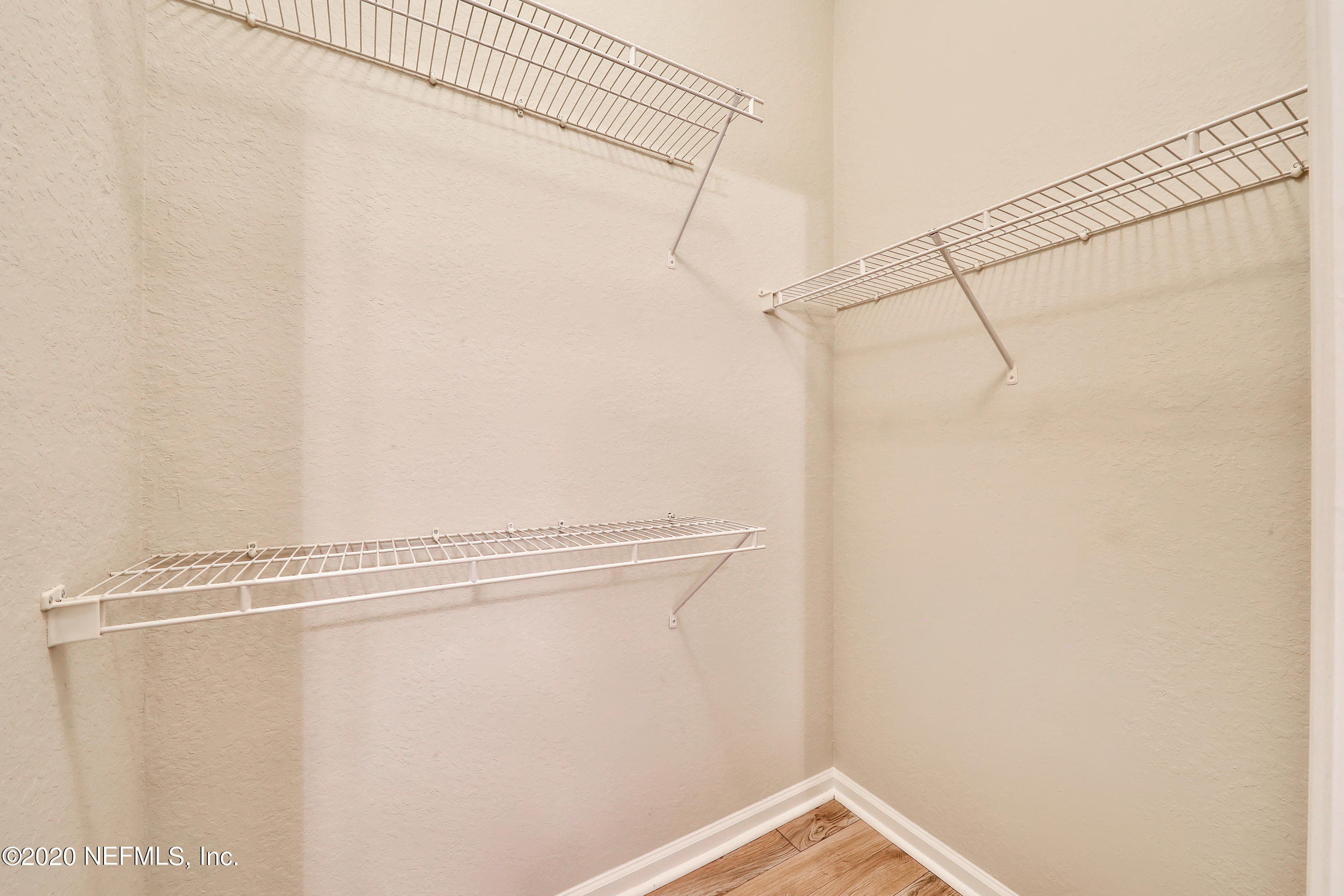 10075 Gate Parkway, Unit 1009 Jacksonville, FL 32246 - Photo 26 of 51 a view of a room with racks on the wall