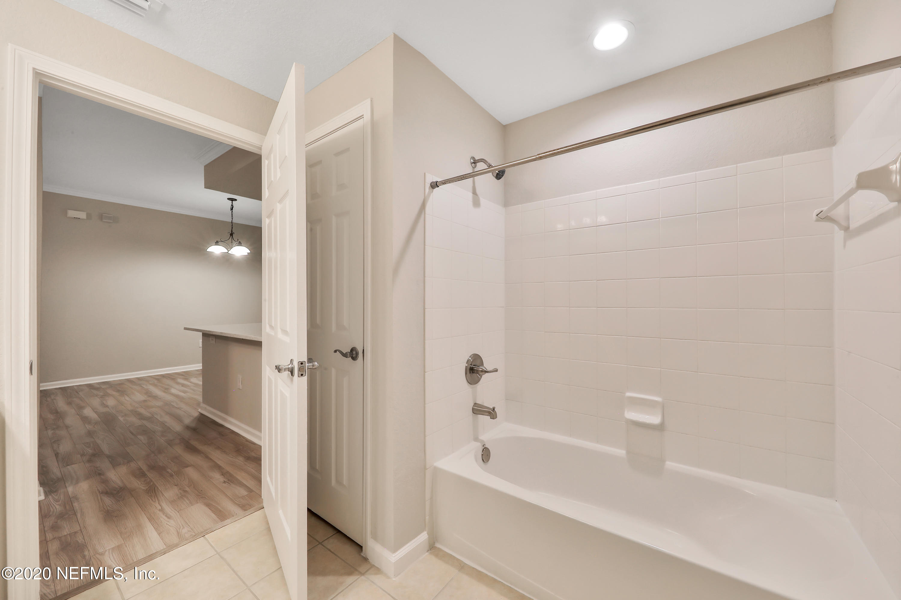 10075 Gate Parkway, Unit 1009 Jacksonville, FL 32246 - Photo 28 of 51 a bathroom with a bathtub and a shower