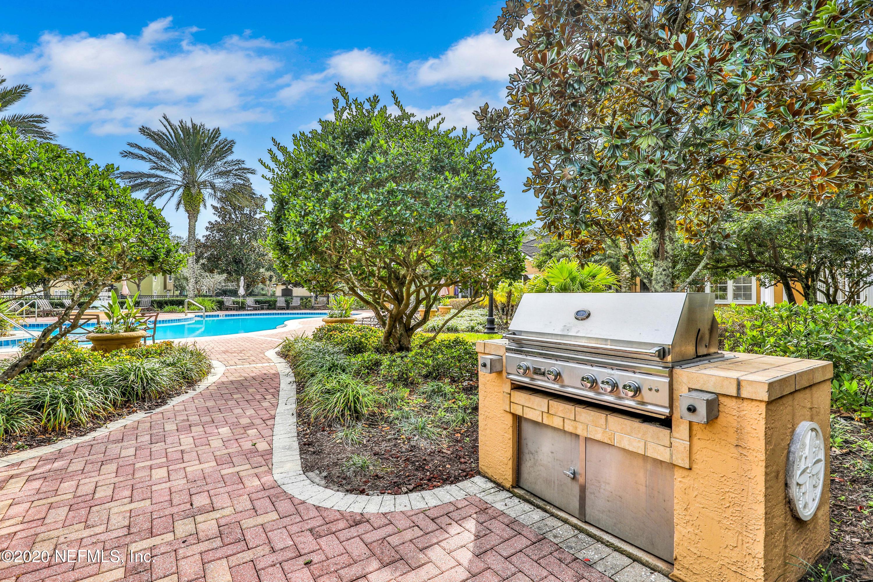 10075 Gate Parkway, Unit 1009 Jacksonville, FL 32246 - Photo 37 of 51 a open grill with a yard