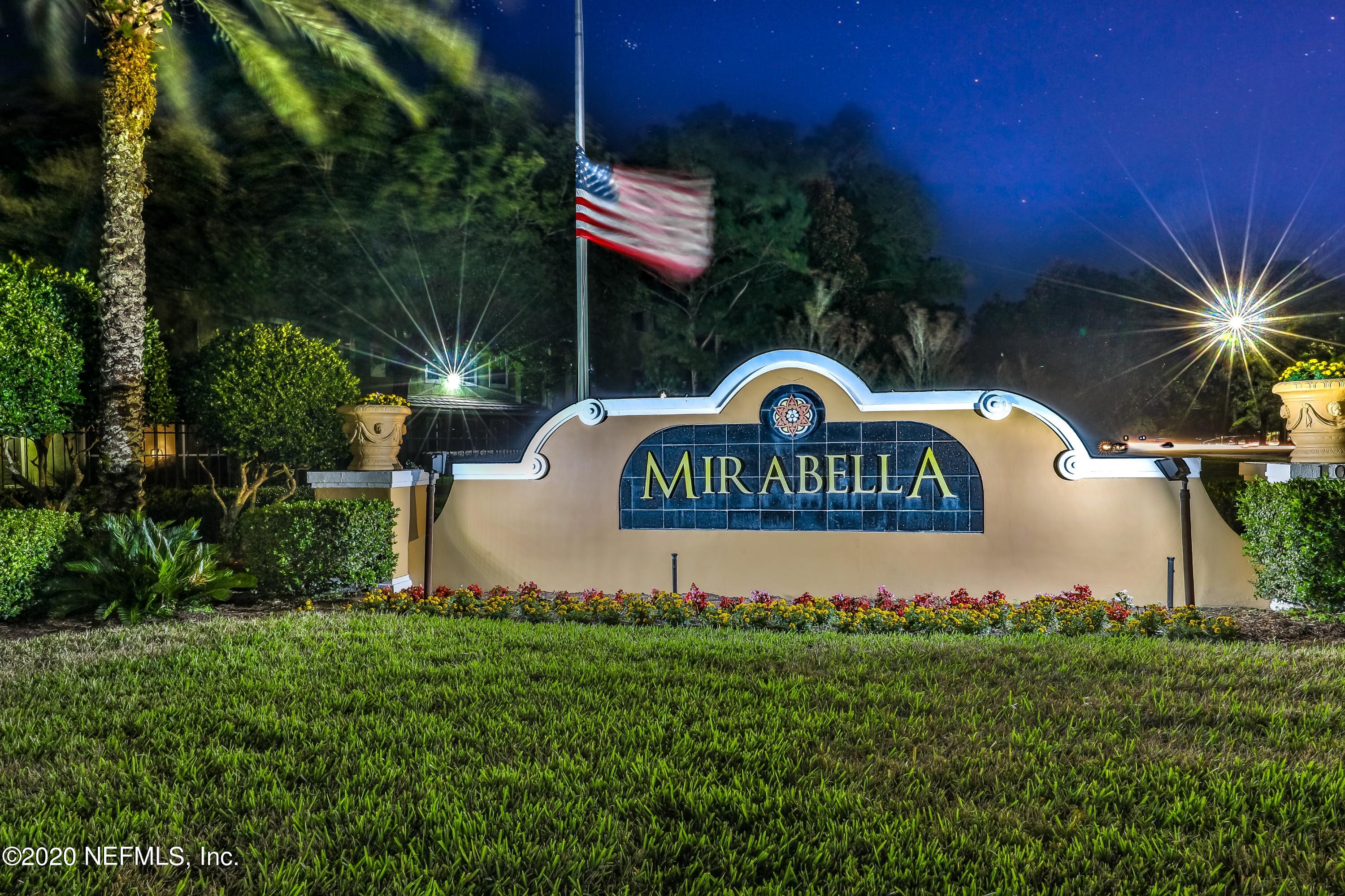 10075 Gate Parkway, Unit 1009 Jacksonville, FL 32246 - Photo 41 of 51 a sign of golf club on a wall under a tree