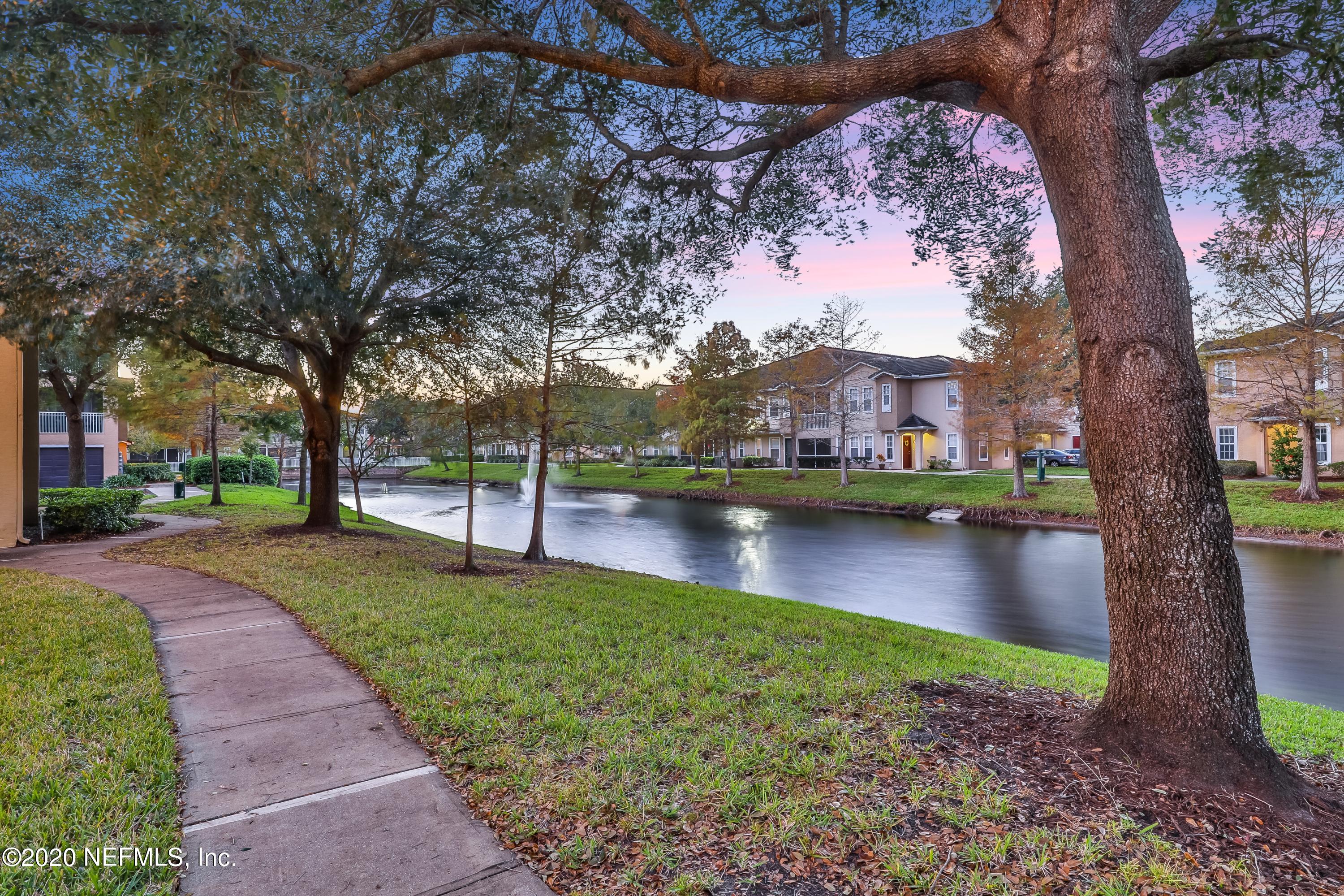 10075 Gate Parkway, Unit 1009 Jacksonville, FL 32246 - Photo 42 of 51 a view of a lake with houses