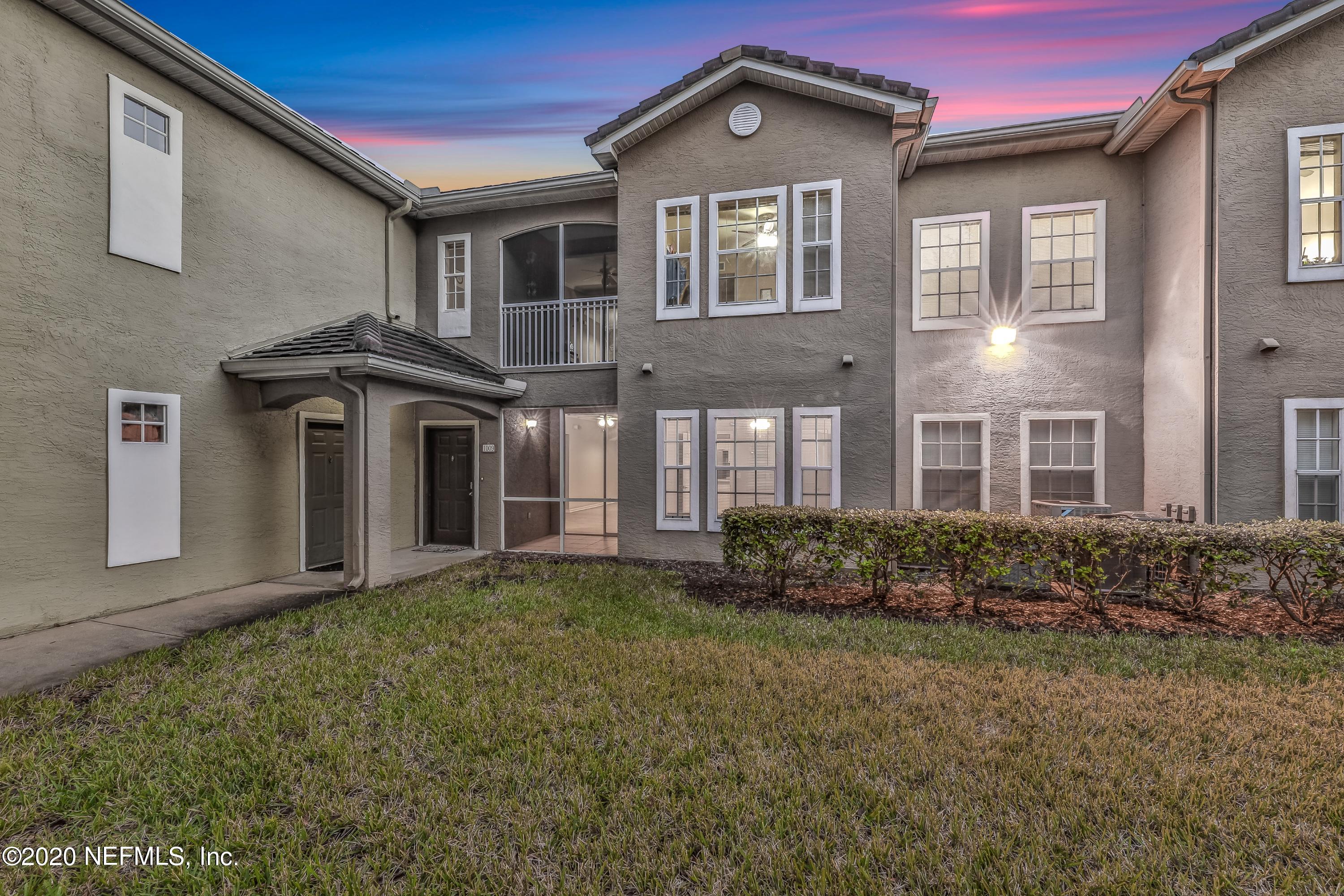 10075 Gate Parkway, Unit 1009 Jacksonville, FL 32246 - Photo 43 of 51 a front view of a house with garden