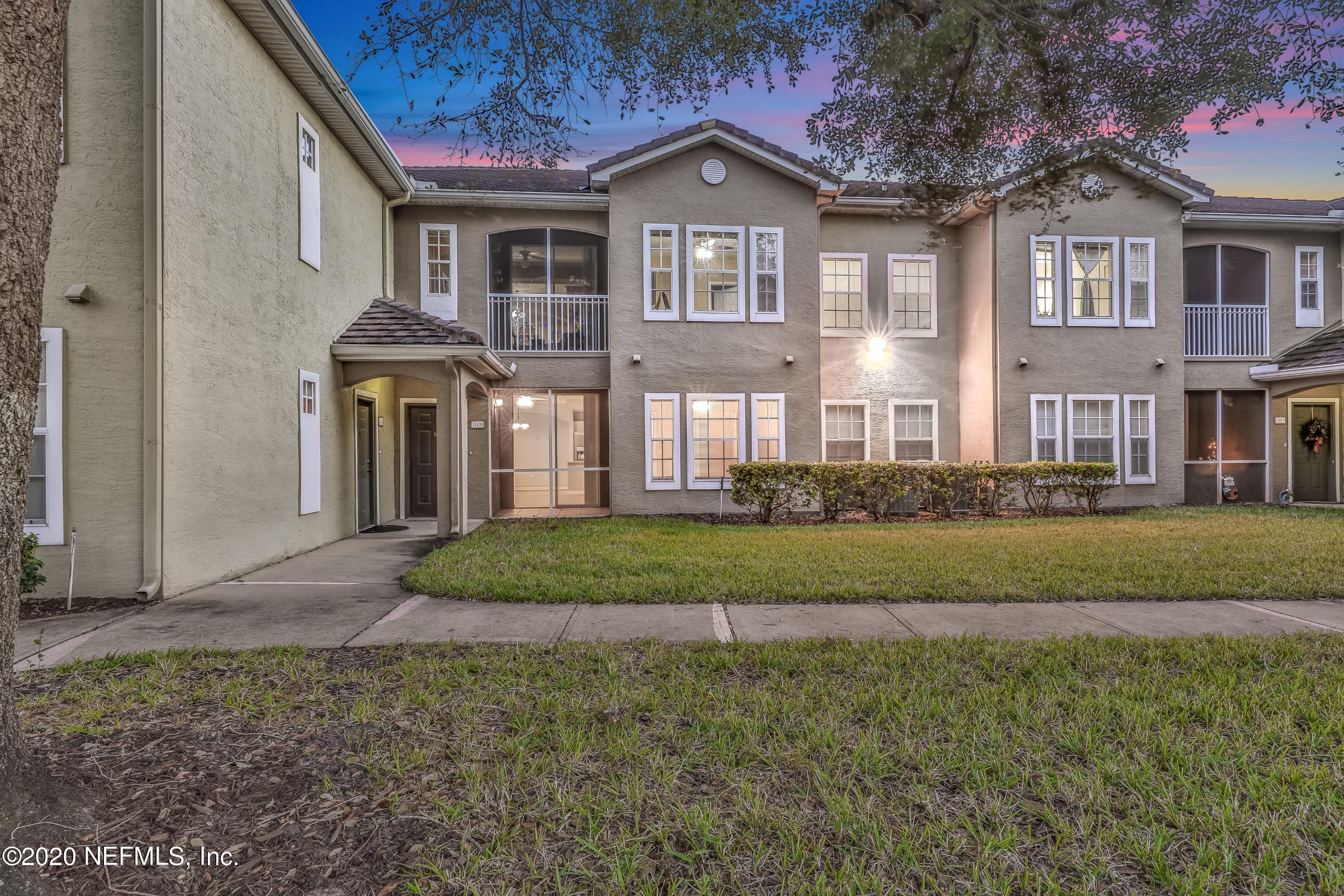 10075 Gate Parkway, Unit 1009 Jacksonville, FL 32246 - Photo 44 of 51 a front view of a house with a yard