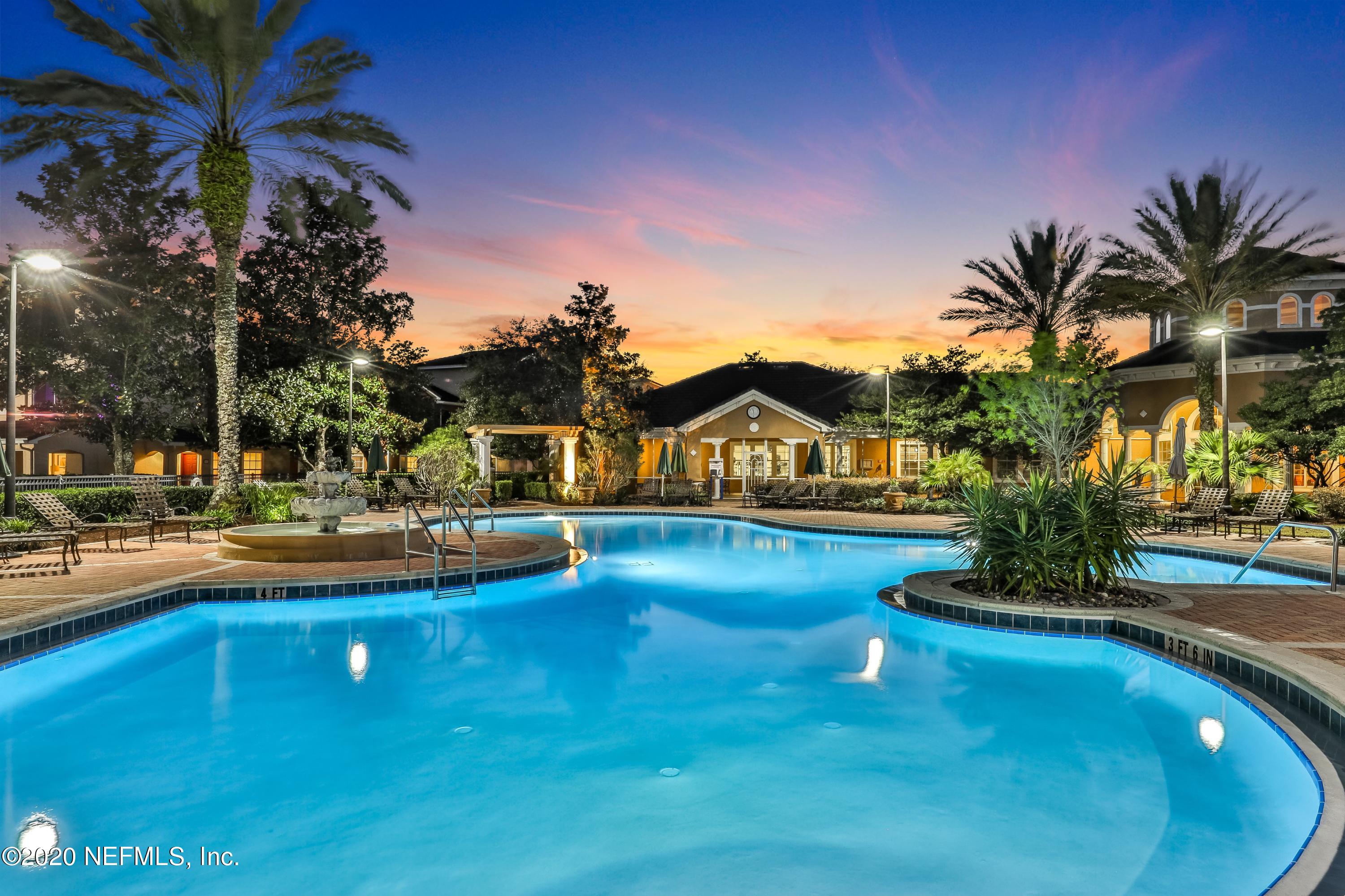10075 Gate Parkway, Unit 1009 Jacksonville, FL 32246 - Photo 47 of 51 a view of a swimming pool and lounge chair