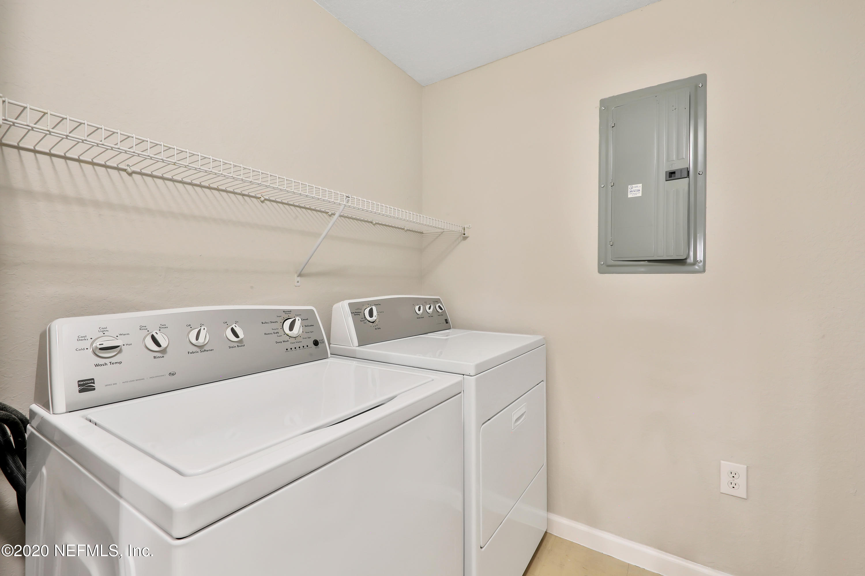 10075 Gate Parkway, Unit 1009 Jacksonville, FL 32246 - Photo 6 of 51 a utility room with dryer and washer