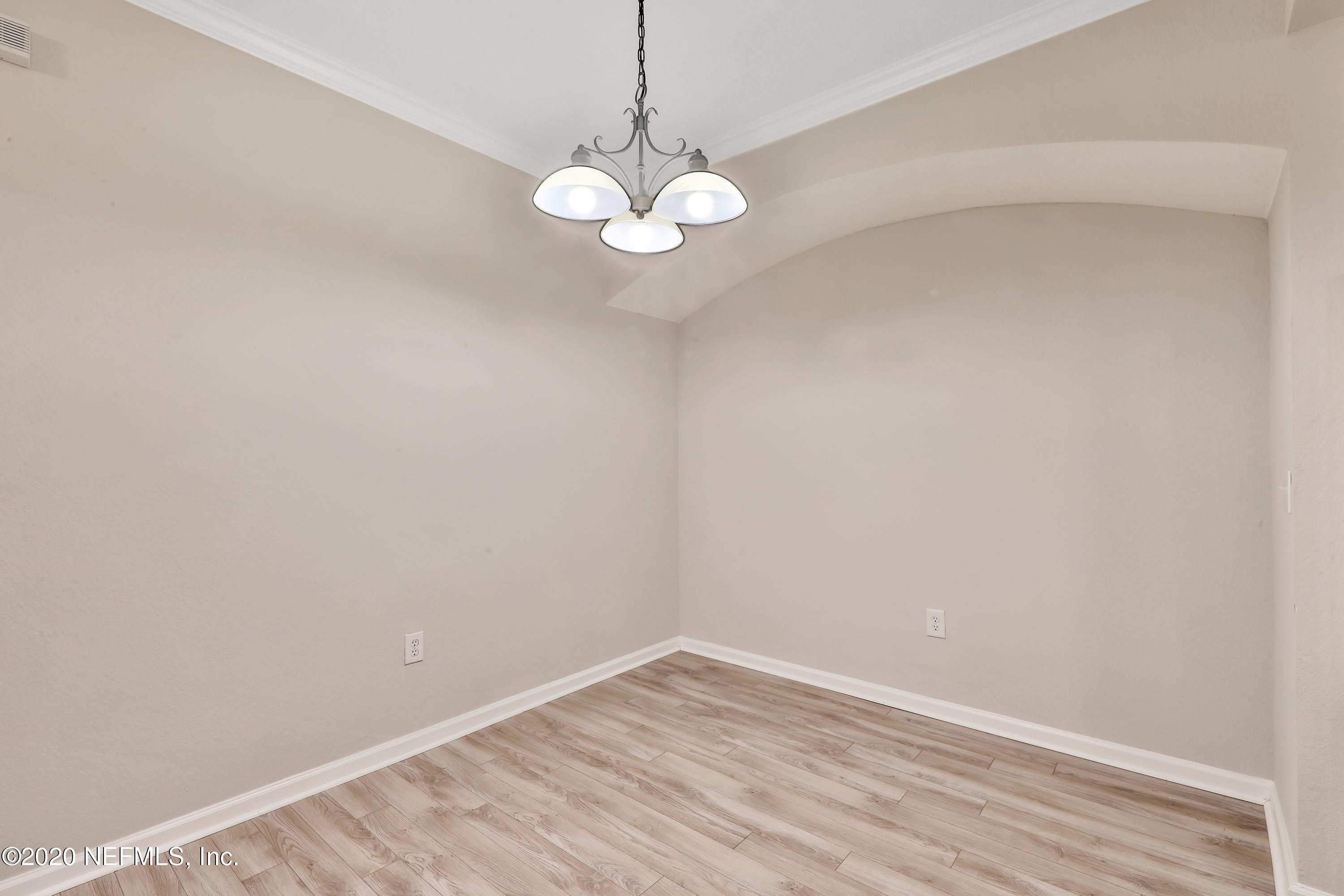 10075 Gate Parkway, Unit 1009 Jacksonville, FL 32246 - Photo 10 of 51 a view of room with window and wooden floor