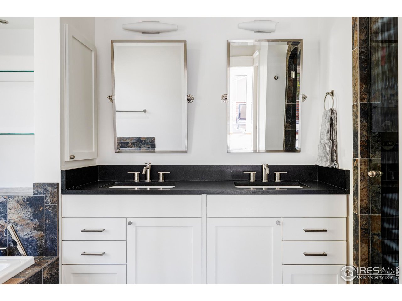 2129 23rd Street Boulder, CO 80302 - Photo 21 of 32 a bathroom with a sink and a mirror