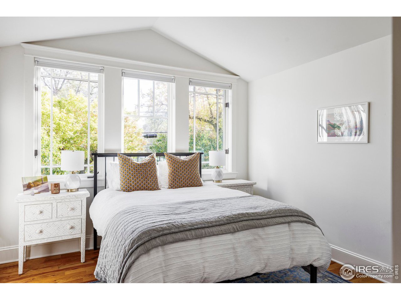 2129 23rd Street Boulder, CO 80302 - Photo 25 of 32 a bedroom with a bed and a large window