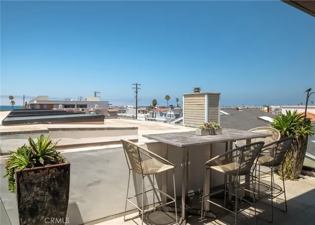 a view of a terrace with furniture and a potted plant