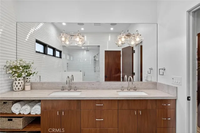 a bathroom with a sink double vanity and a mirror