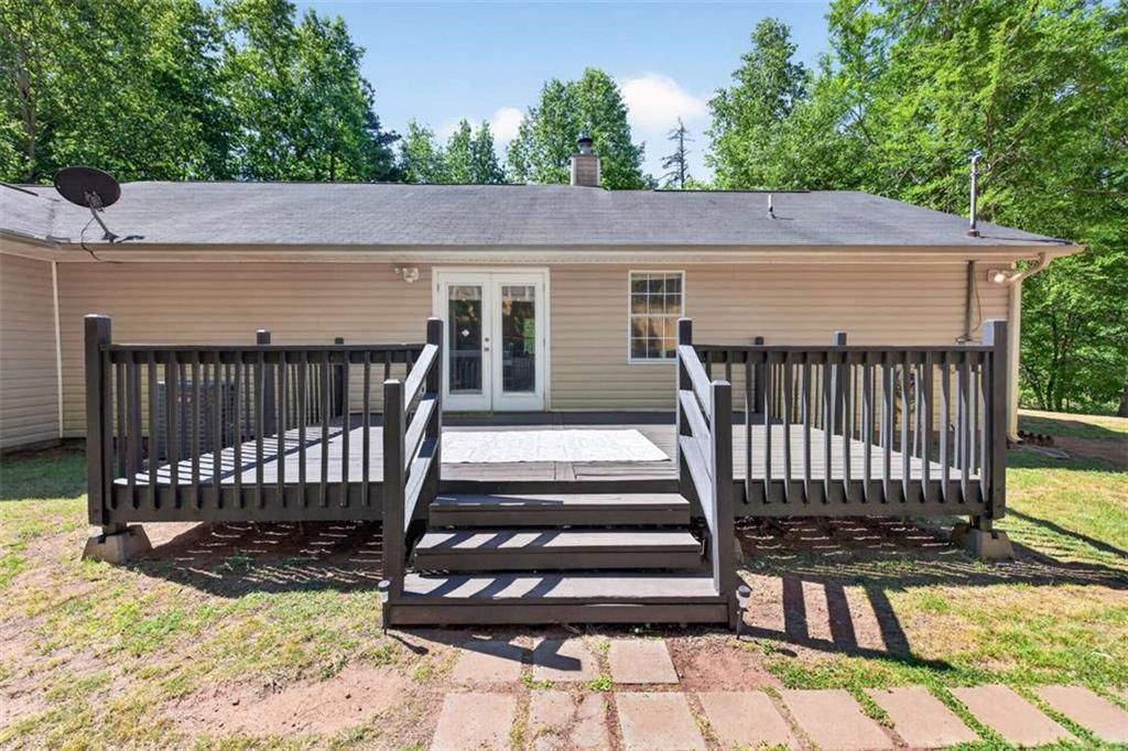 386 Ridgewood Drive Pendergrass, GA 30567 - Photo 41 of 50 a view of a house with wooden deck