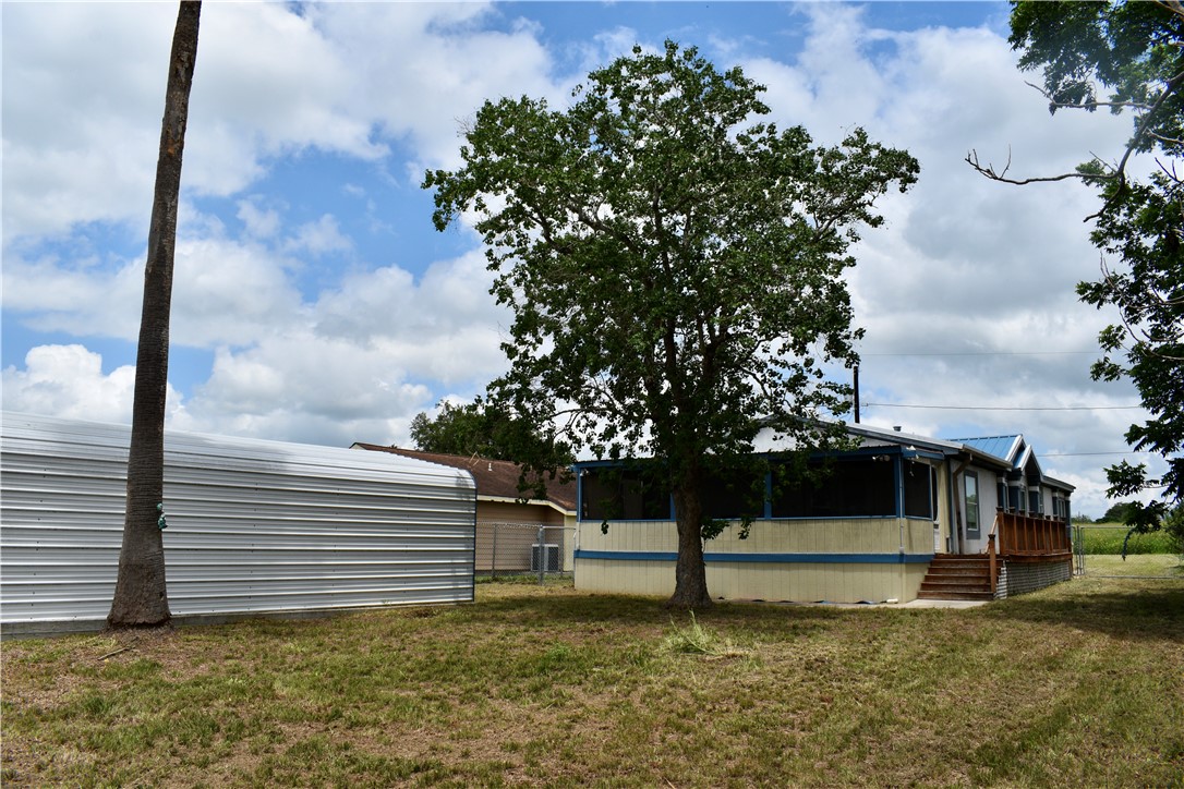 25051 Lake Shore Drive Mathis, TX 78368 - Photo 4 of 40 a view of a house with a yard