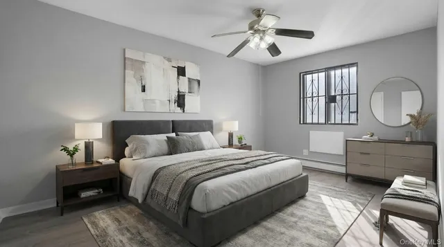 a bedroom with bed and a chandelier