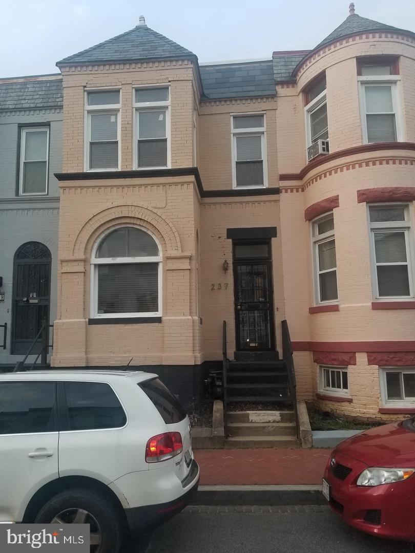 a front view of a house with parking