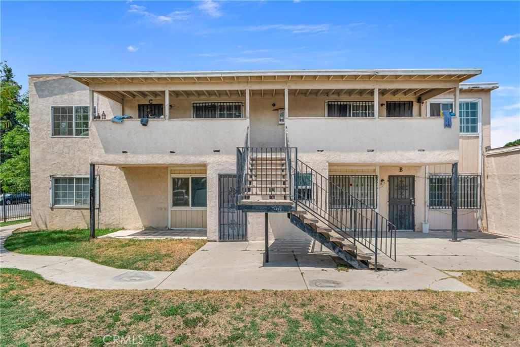 1031 North Lilac Avenue Rialto, CA 92376 - Photo 1 of 1 a front view of a house with a yard