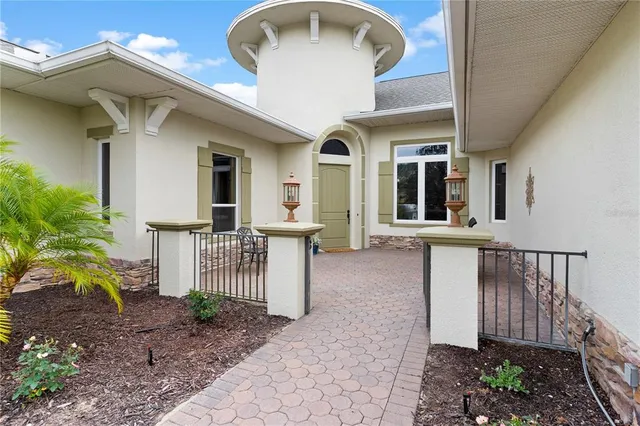 a living room with furniture or couch and a large window