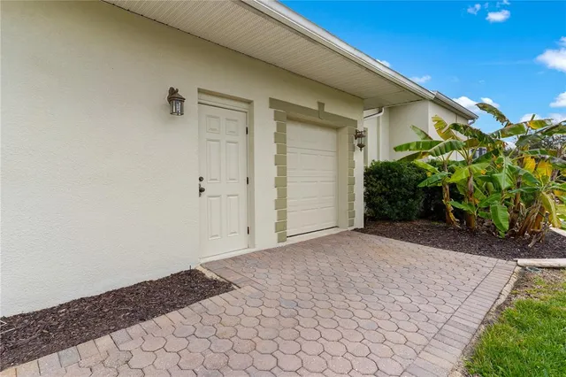 a kitchen with stainless steel appliances kitchen island granite countertop a sink and cabinets