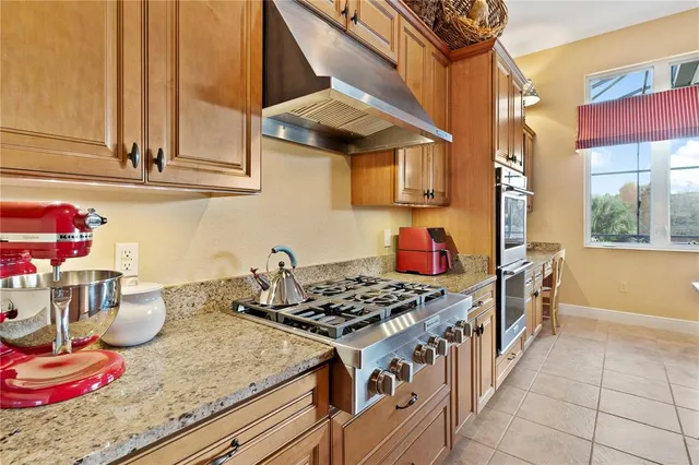 a bed room with a bed and a chandelier