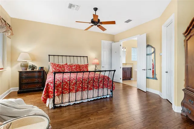 a bedroom with a bed and a couch